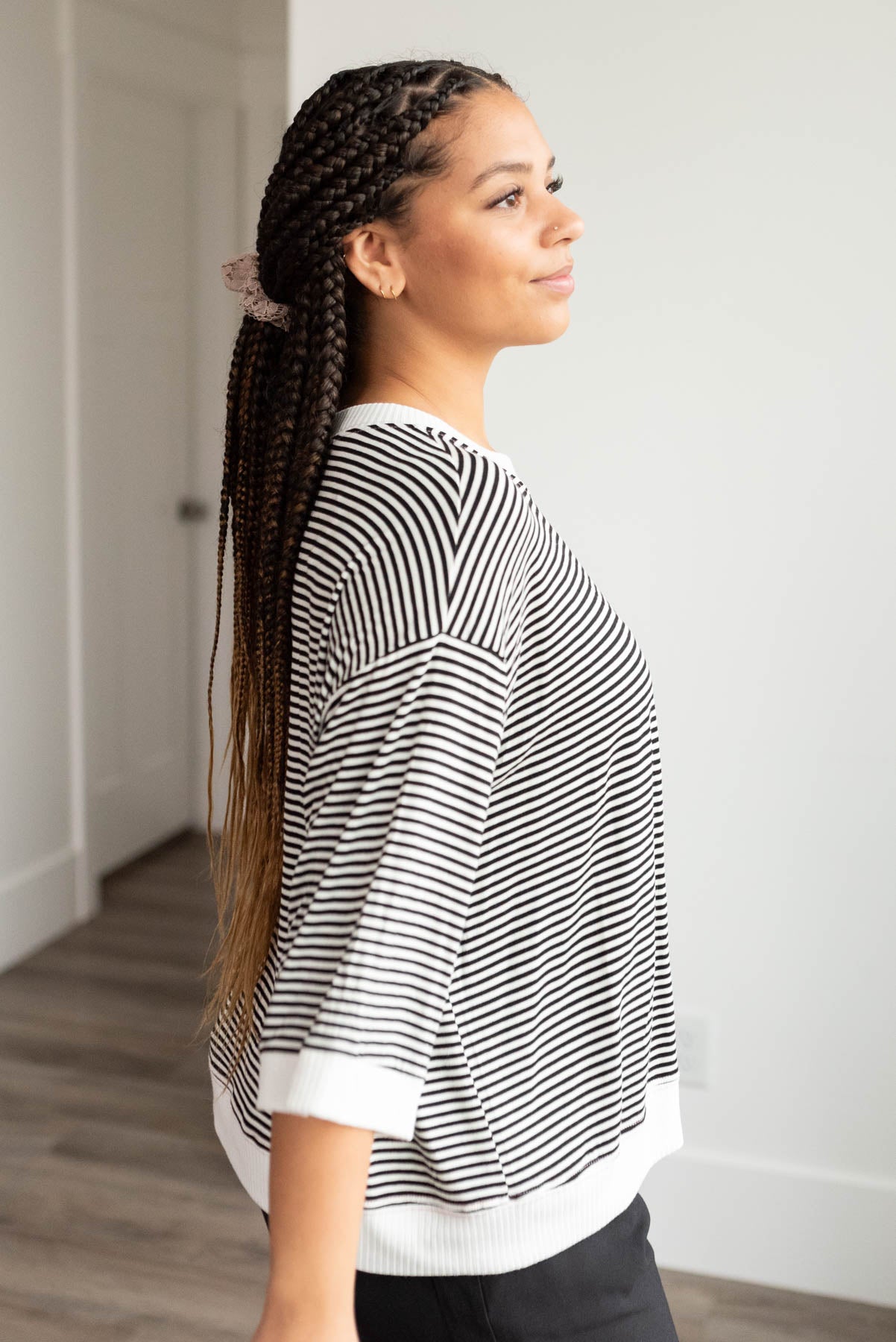 Side view of the black stripe top