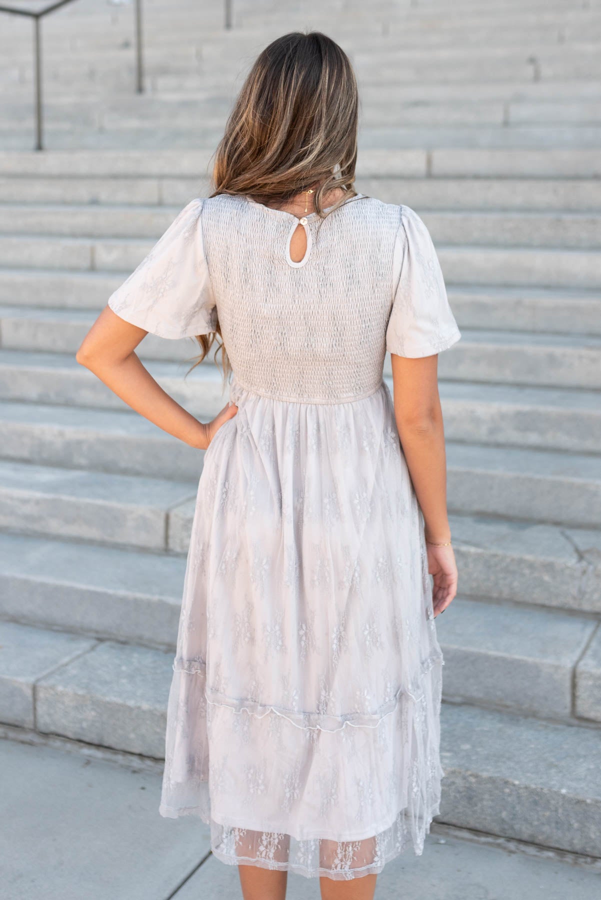 Back view of the grey floral lace dress