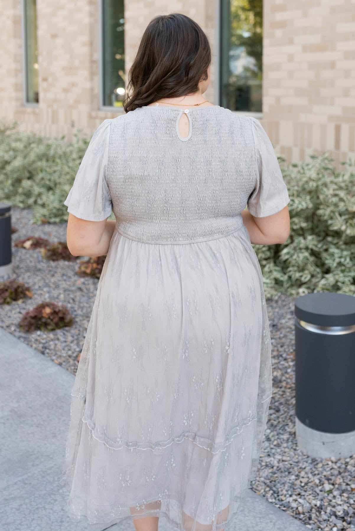 Back view of the plus size grey flroal lace dress