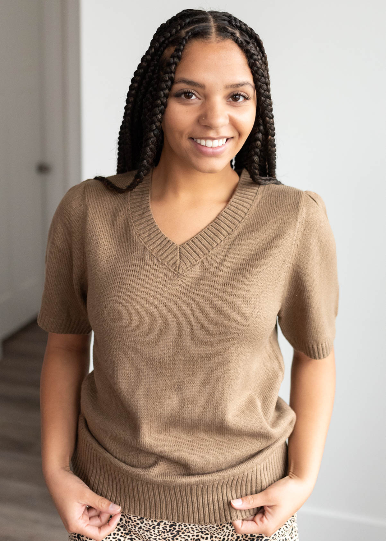 Close up of the taupe short sleeve sweater with a v-neck