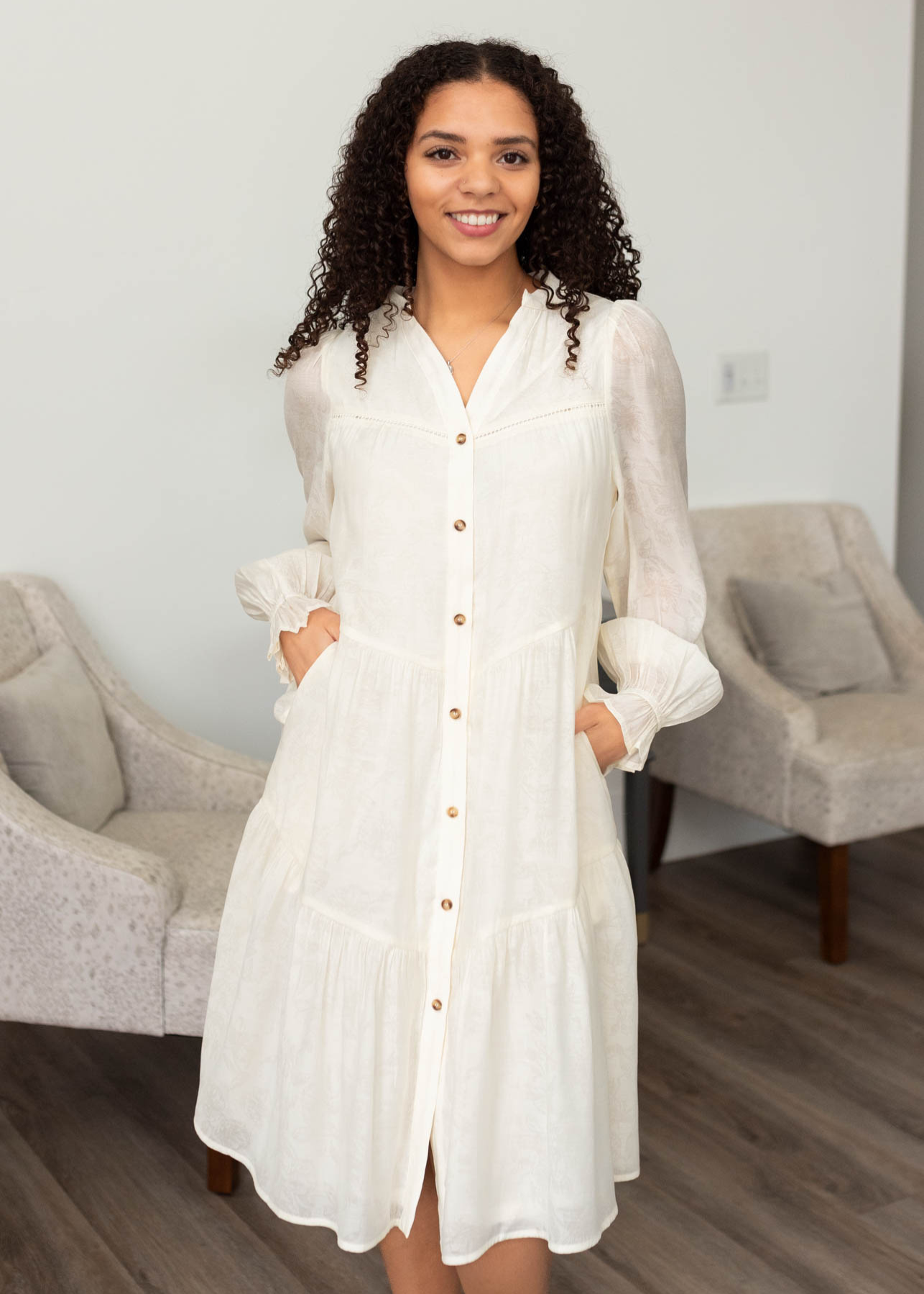 Ivory button down dress with pockets and a tiered skirt