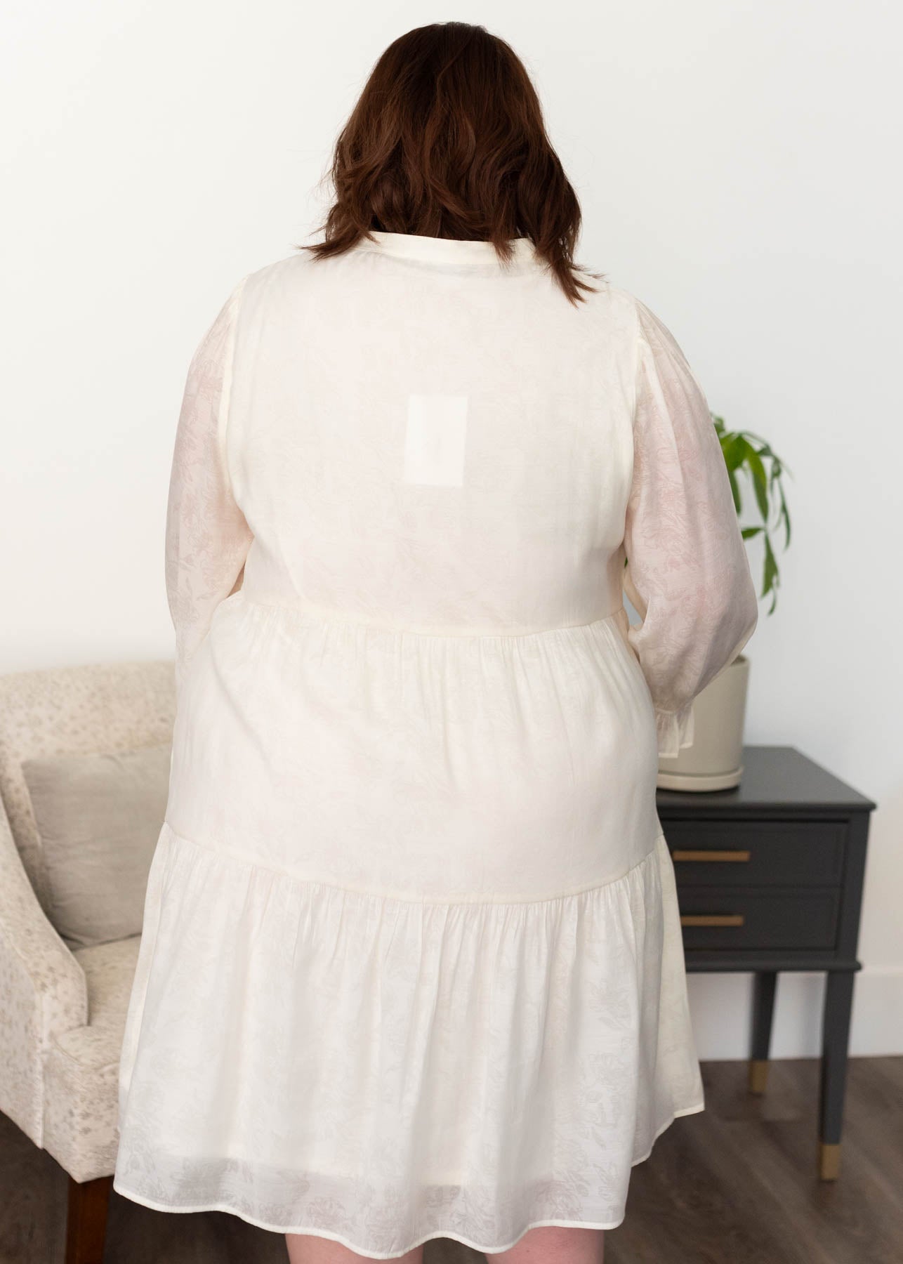 Back view of the plus size ivory button down dress