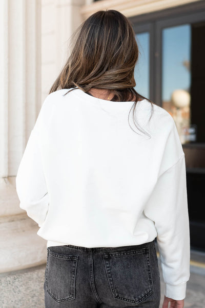 Back view of the white christmas bow sweater