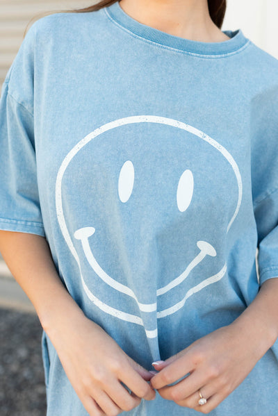 Close up of the smile on the blue smiley midi dress