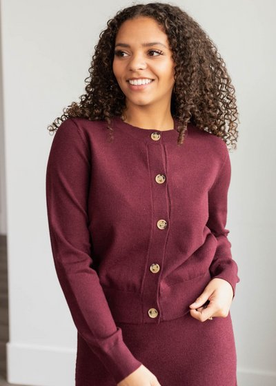 Burgundy knit sweater with long sleeves and buttons