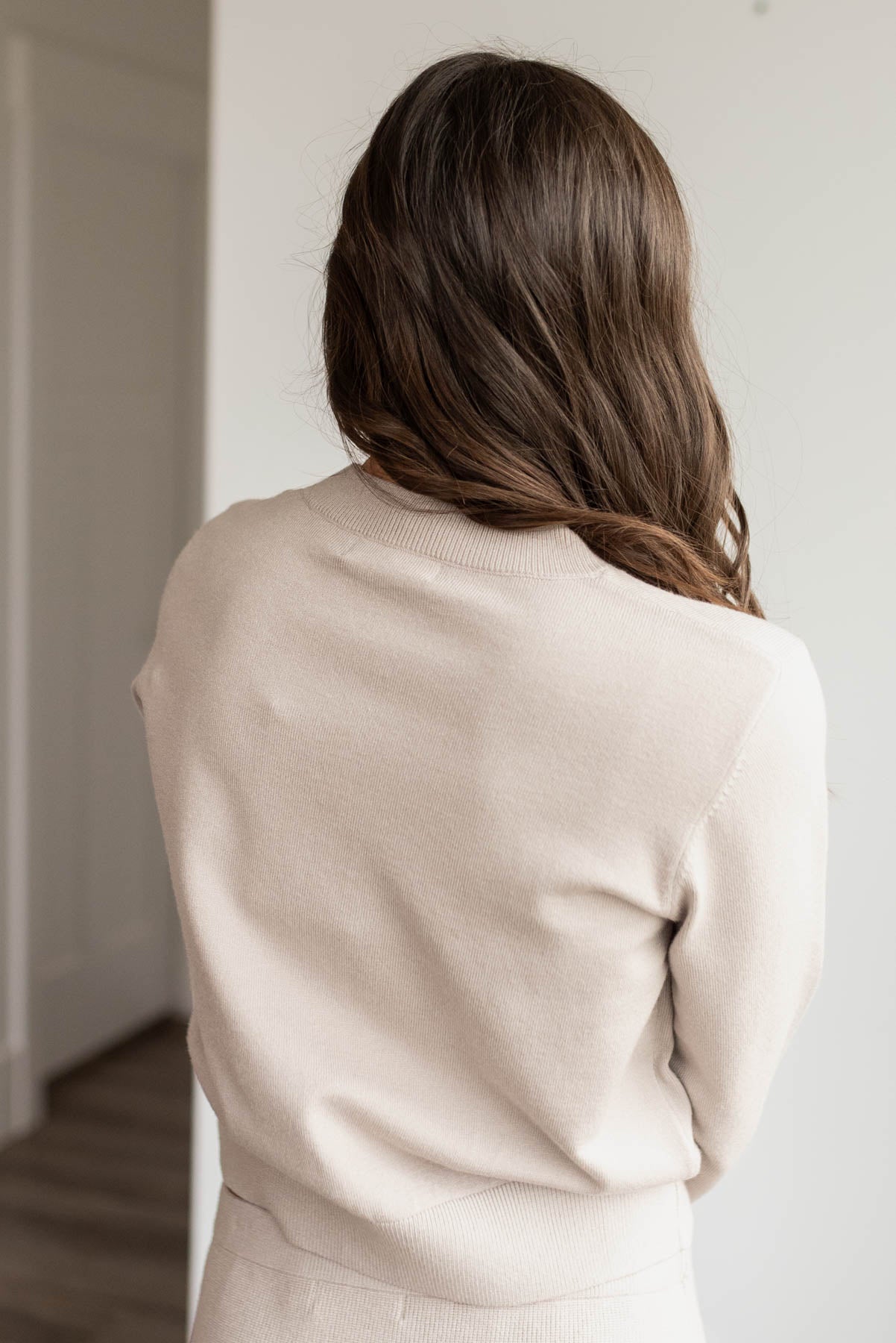 Back view of the oatmeal knit sweater