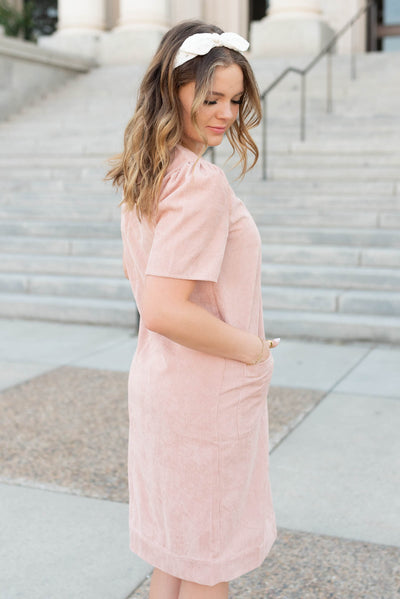 Side view of the blush corduroy dress