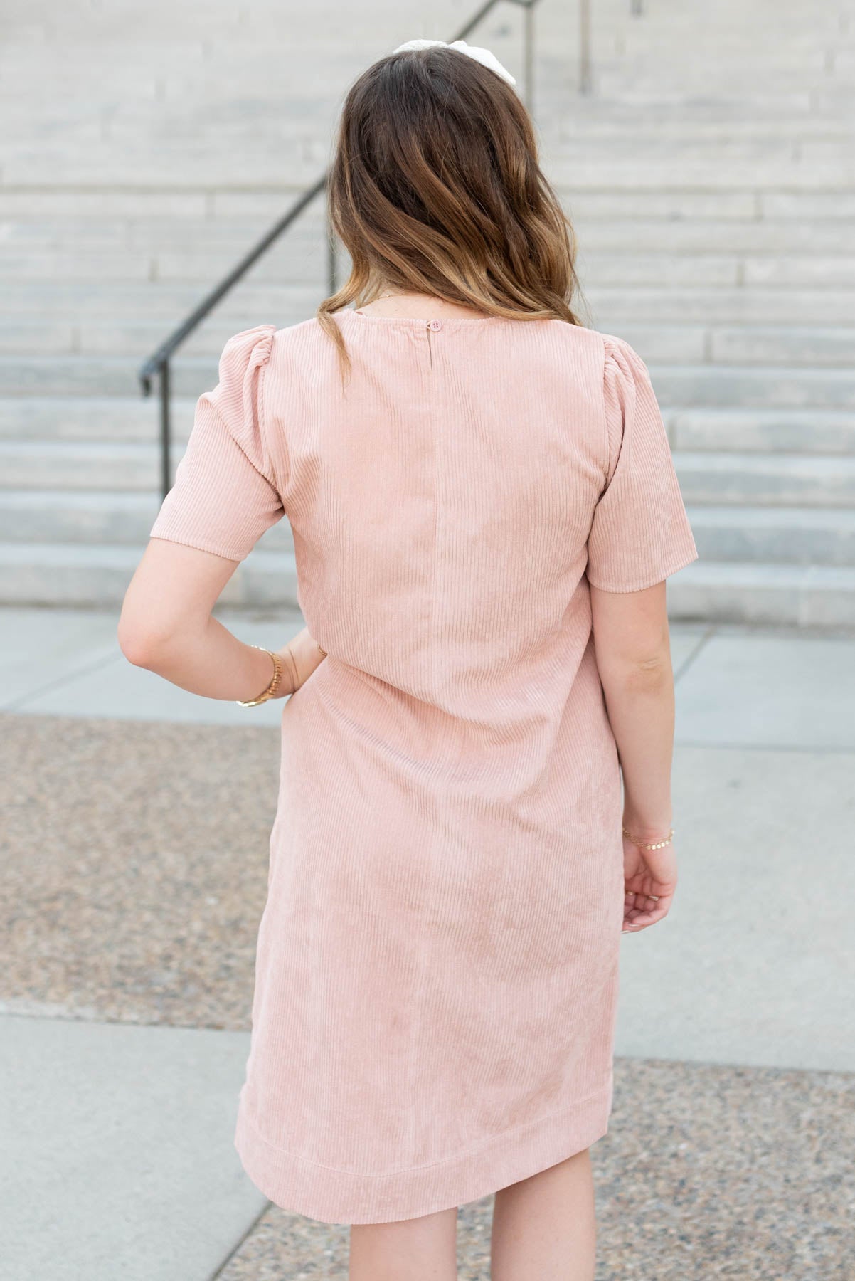 Back view of the blush corduroy dress