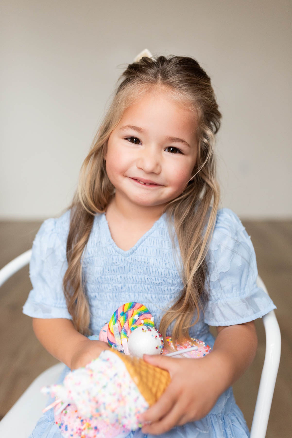 Close up of the smocked bodice of the blue floral tiered little girl dress