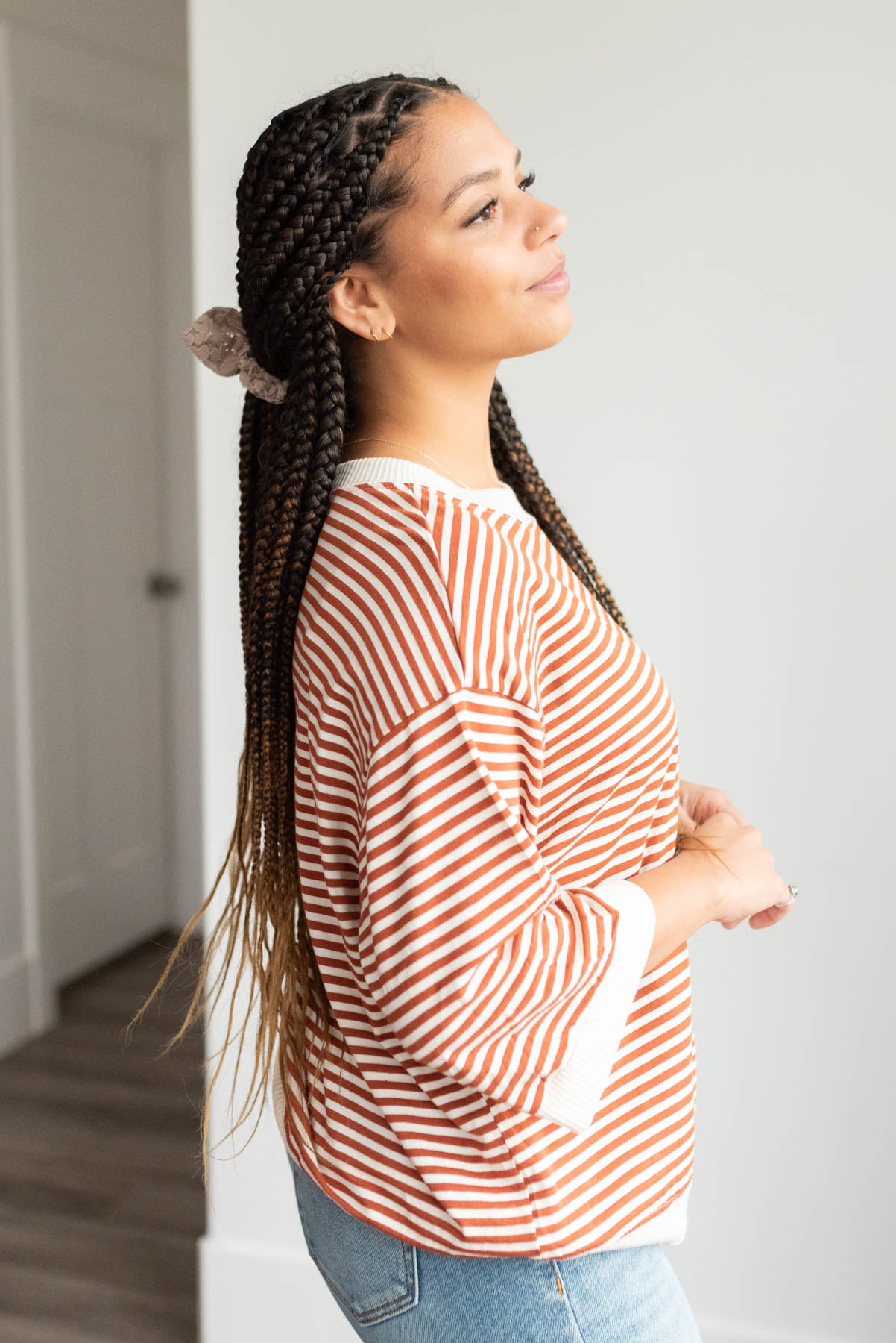 Side view of the ivory and rust stirpe top