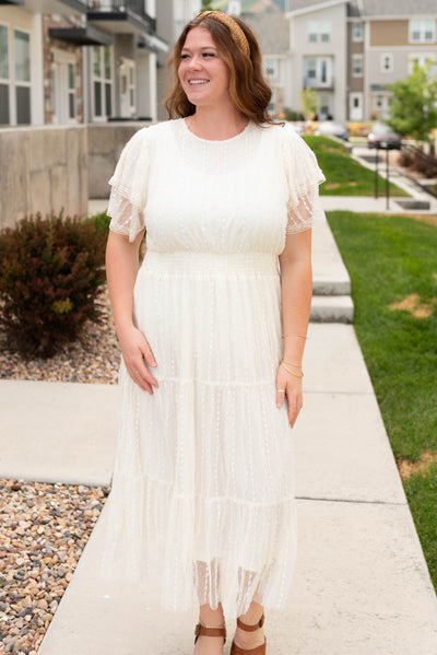 Front view of the plus size cream lace dress