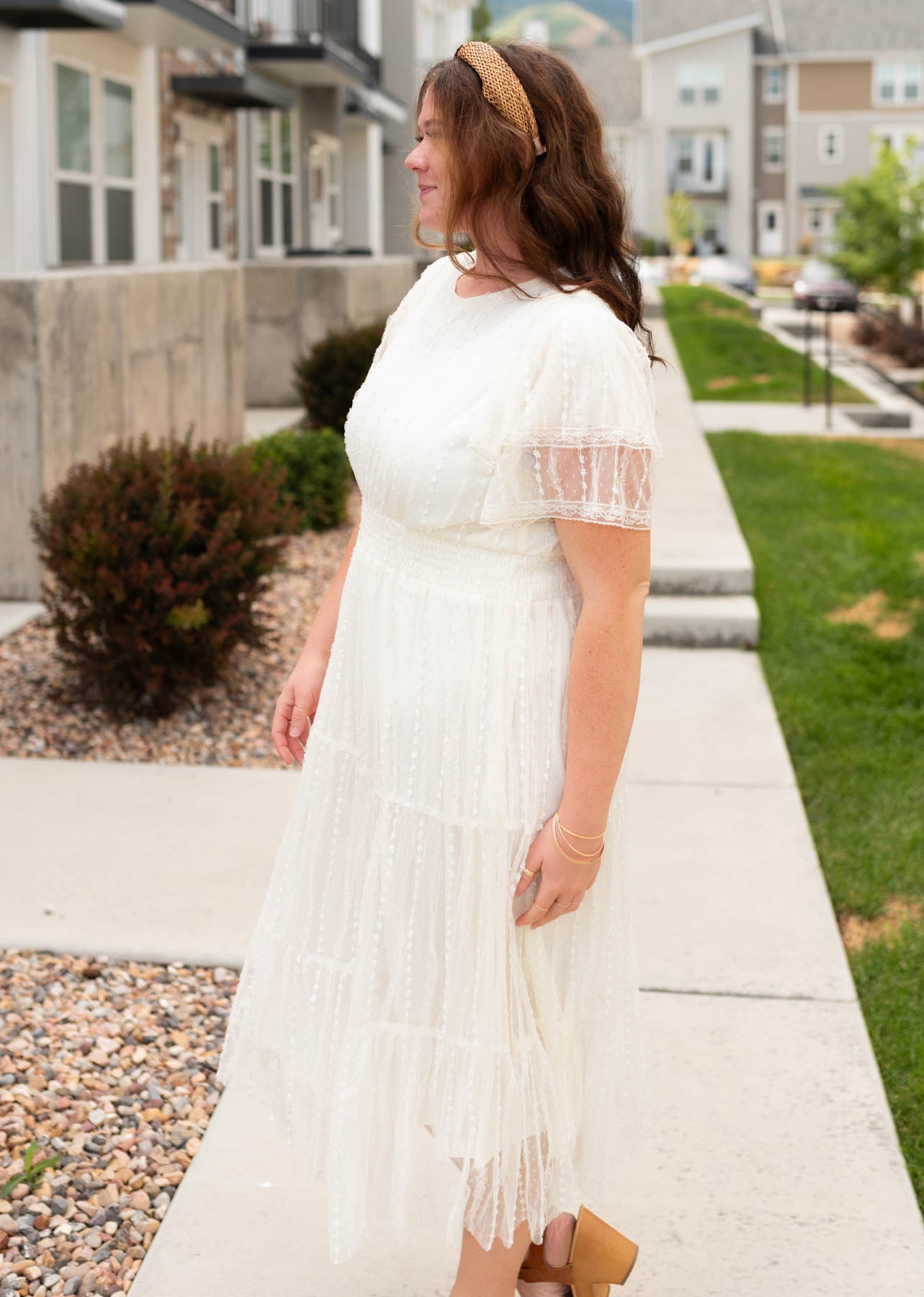 Side view of the cream lace dress in plus size