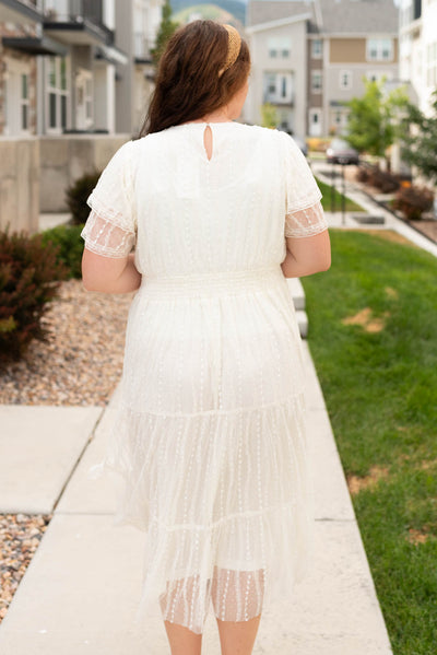 Back view of the plus size cream lace dress