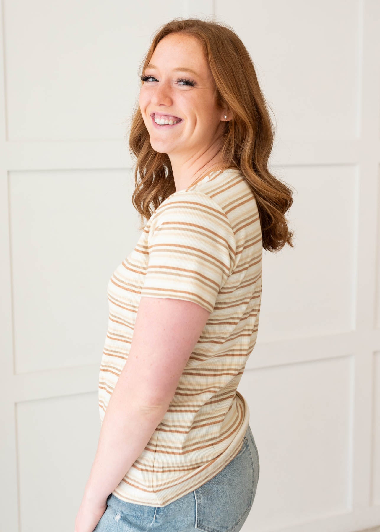 Side view of the taupe stripe top