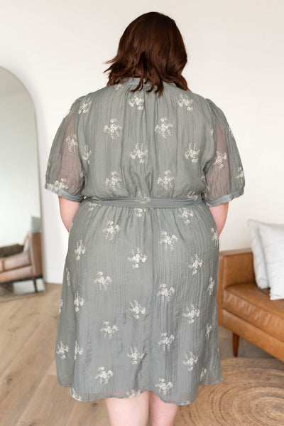 Back view of the plus size dusty sage embroidered dress in plus size