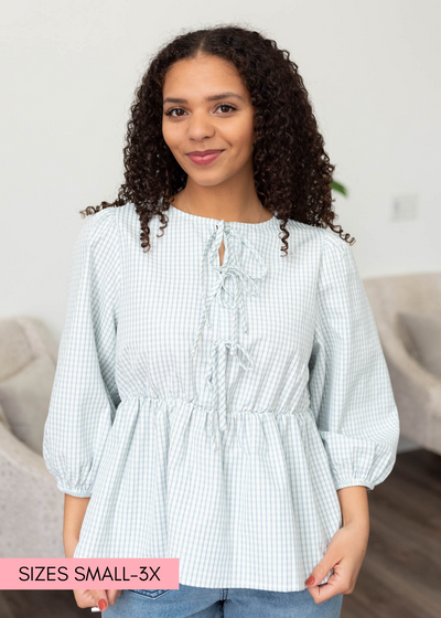 Three tie on the bodice of the light blue stripe top