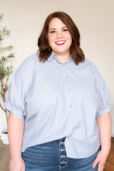 Light blue stripe top with cuffs on the short sleeves