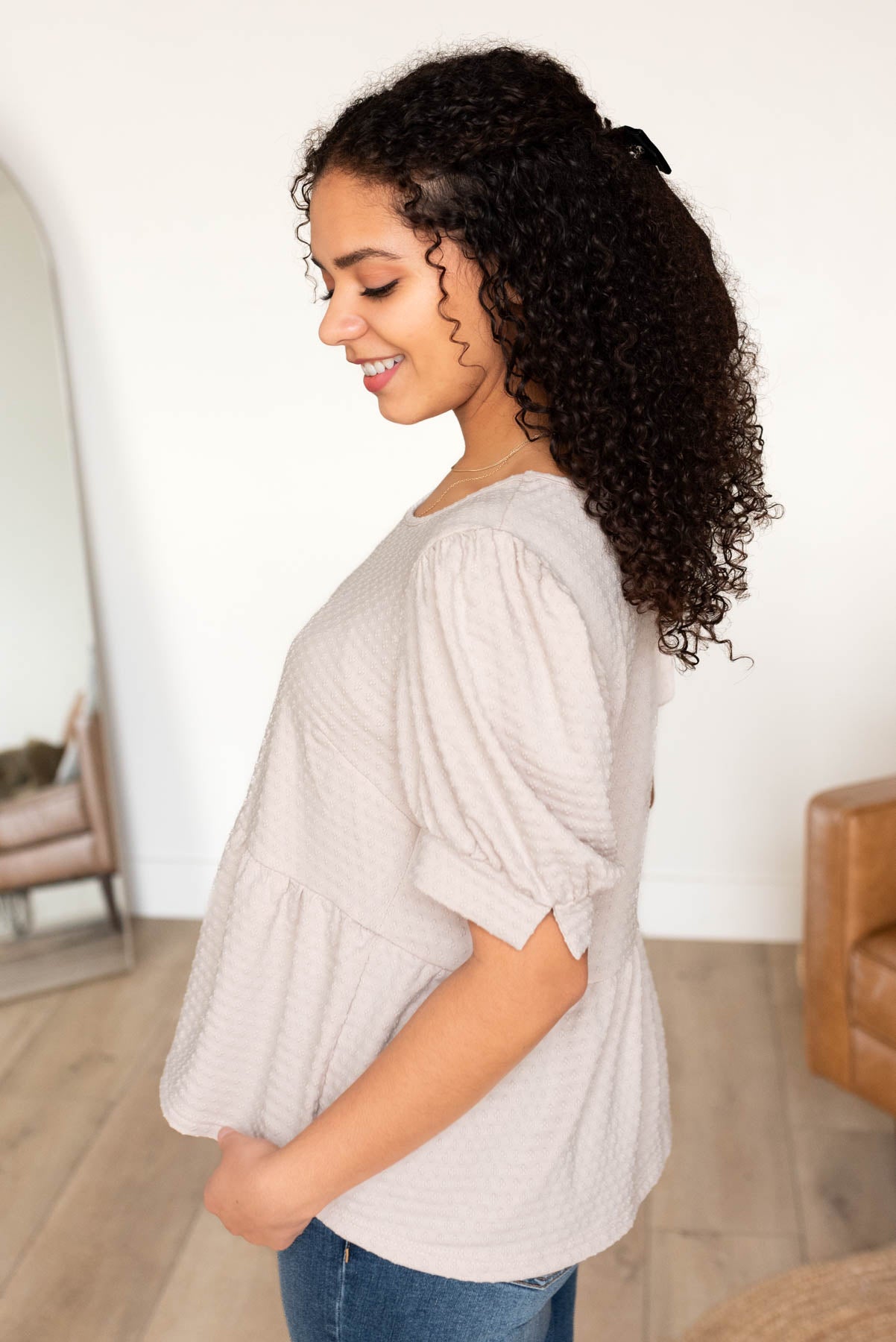 Side view of the beige tiered top