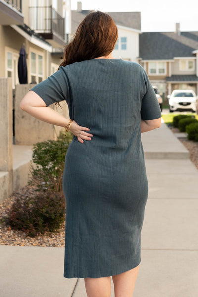 Back view of the plus size dark green sweater dress