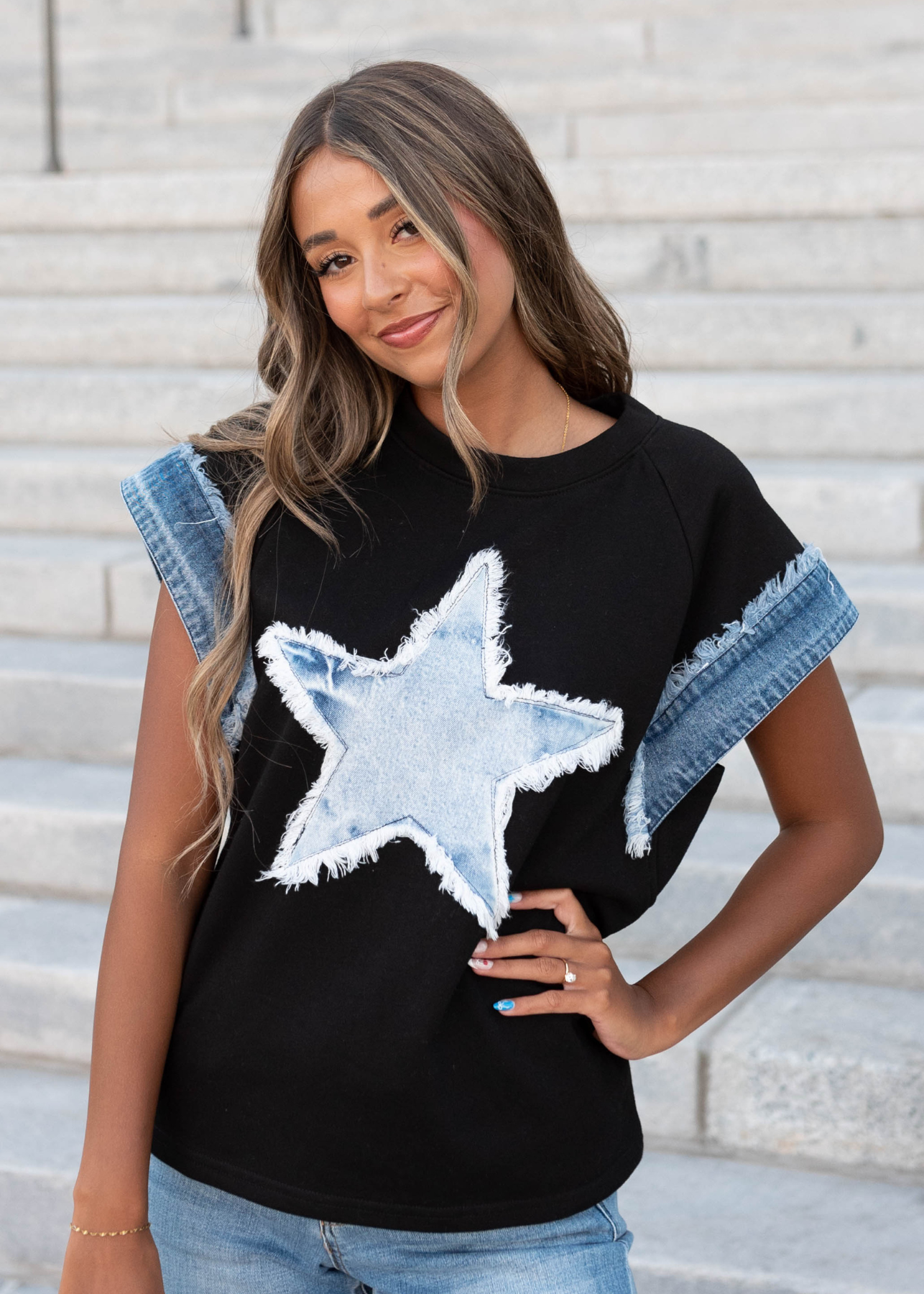 Black denim star top with denim trim of the sleeves