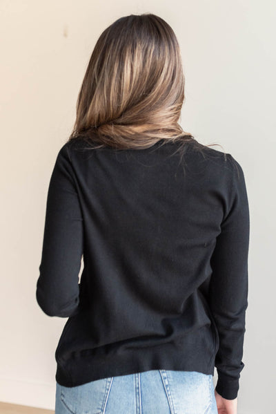 Back view of the black button down cardigan