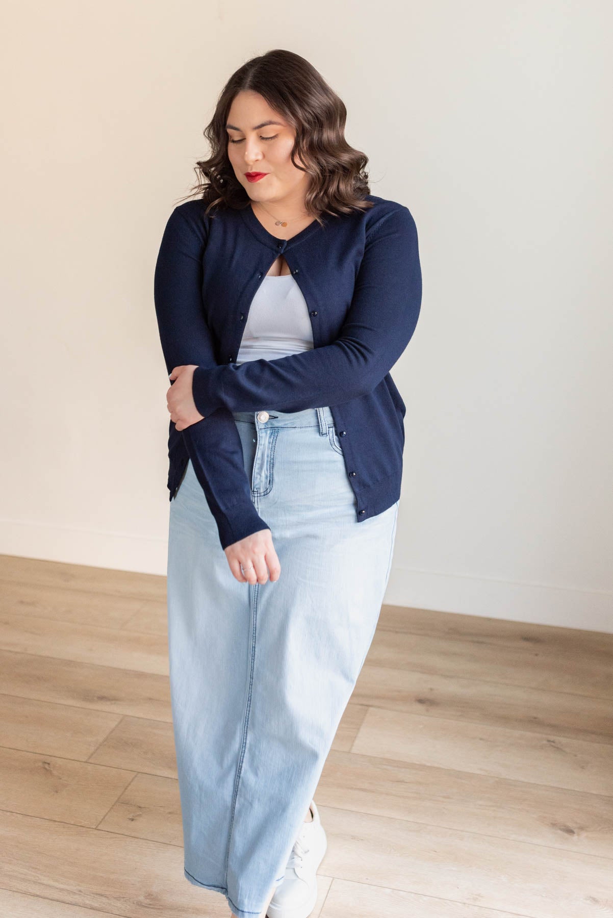 Blue buttons on a navy button down cardigan in plus size