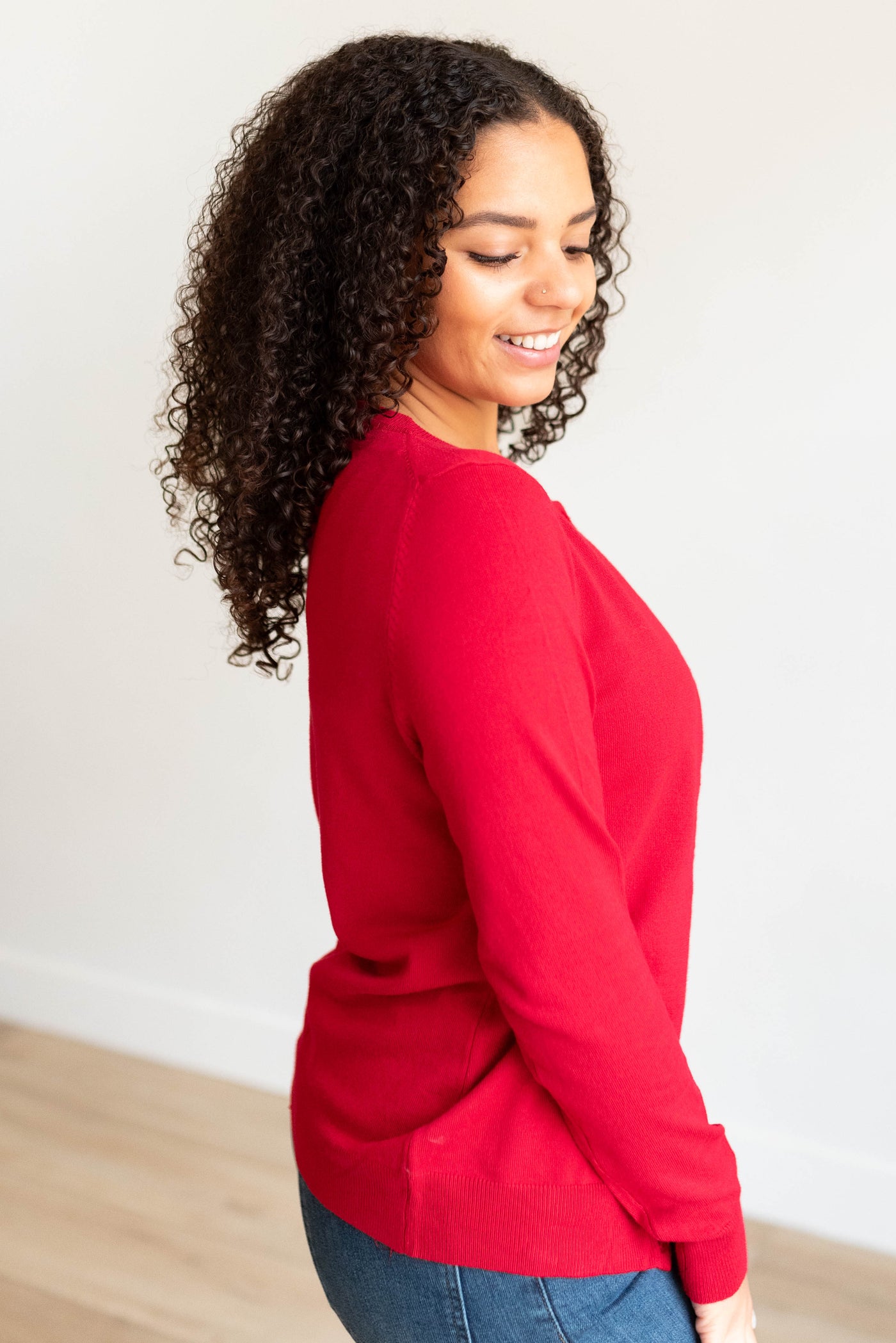 Side view of the red button down cardigan