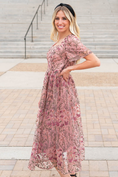 Side view of the antique pink embroidered dress