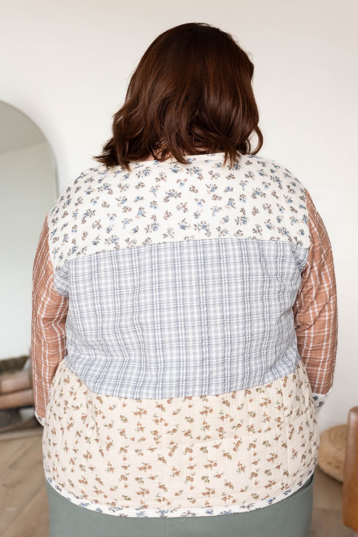 Back view of the plus size ivory pattern block jacket