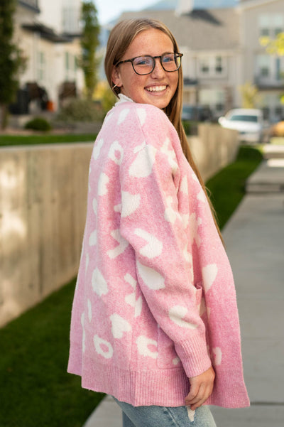 Light pink side of a pink cardigan