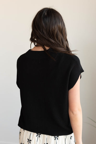 Back view of the black cap sleeve sweater top