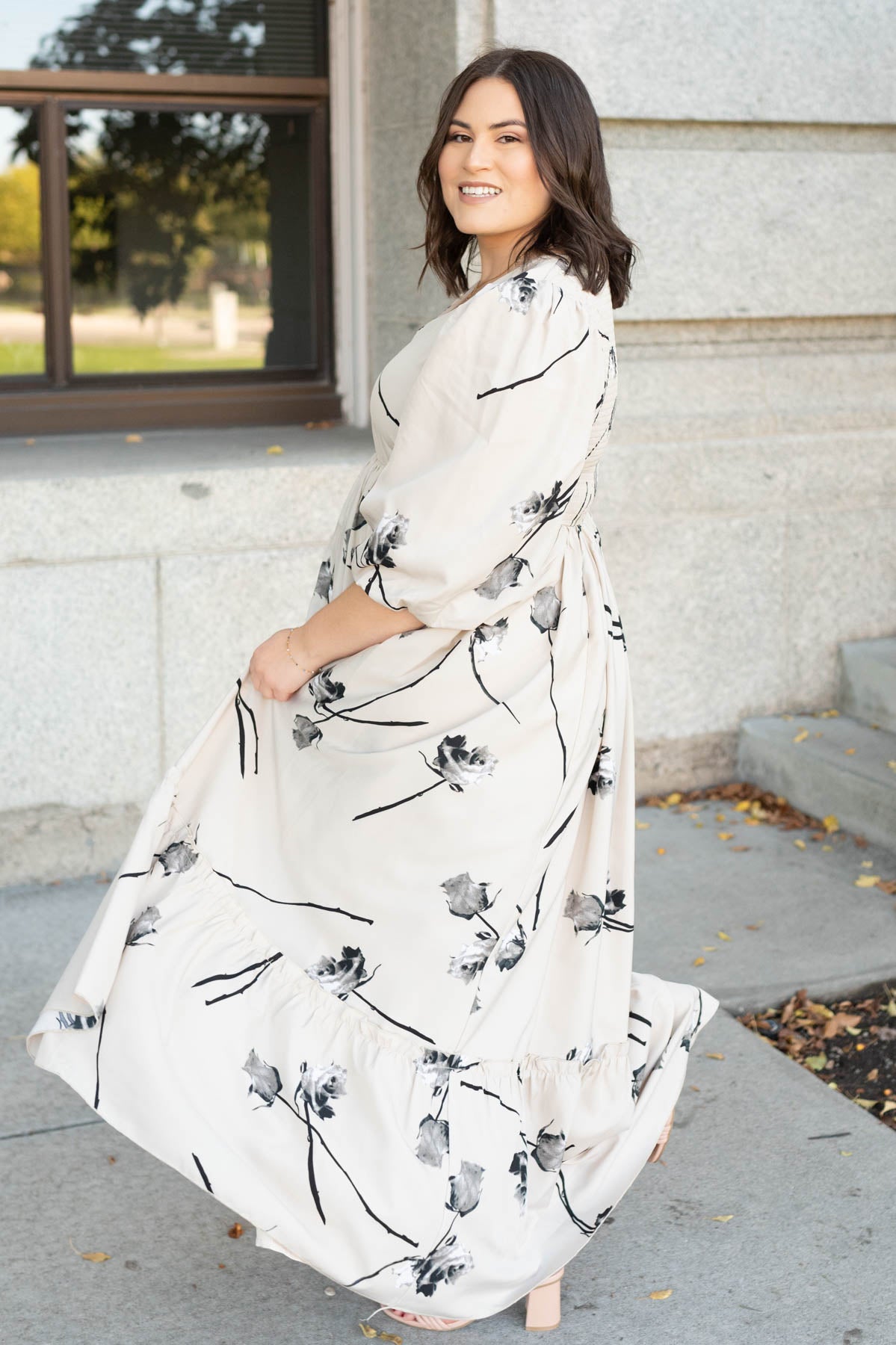 Side view of the plus size beige floral dress