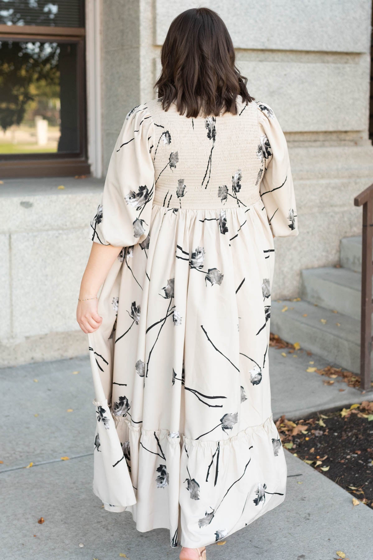 Back view of the plus size beige floral dress