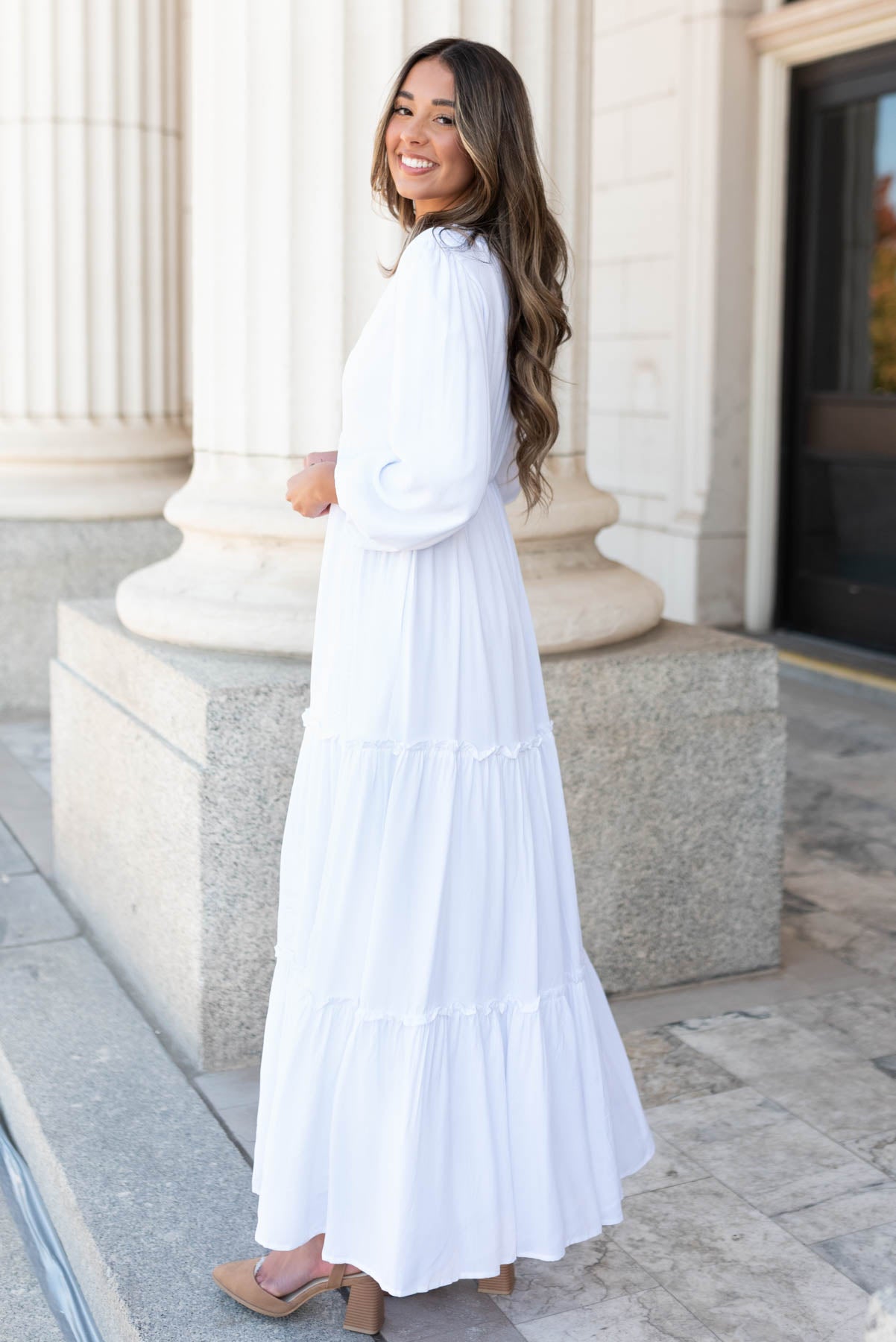 Side view of the white embroidered dress