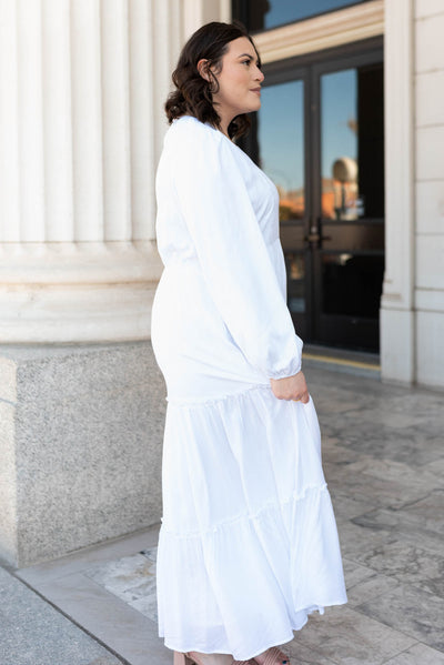 Side view of the plus size white embroidered dress