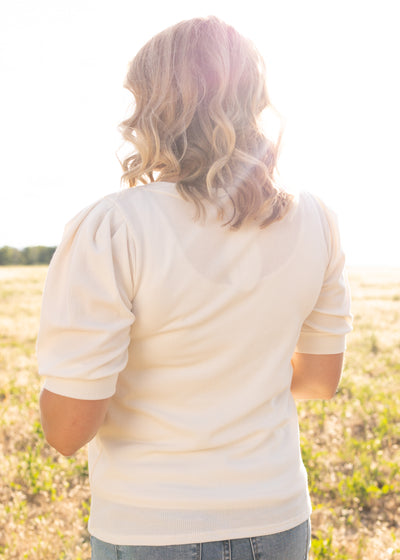 Back view of a cream top