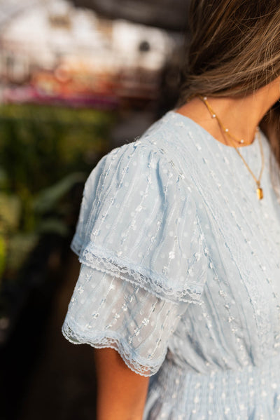 Double ruffle sleeve on the light blue lace dress