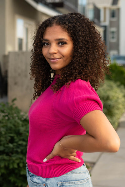 Side view of a fuchsia top