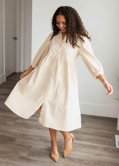 Beige button down dress with long sleeves