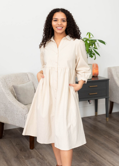 Beige button down dress with pockets and three quater sleeves