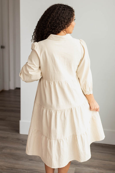 Back view of the beige button down dress