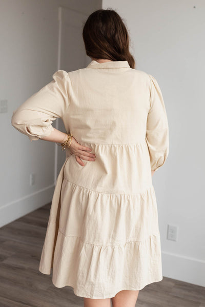 Back view of the plus size beige button down dress