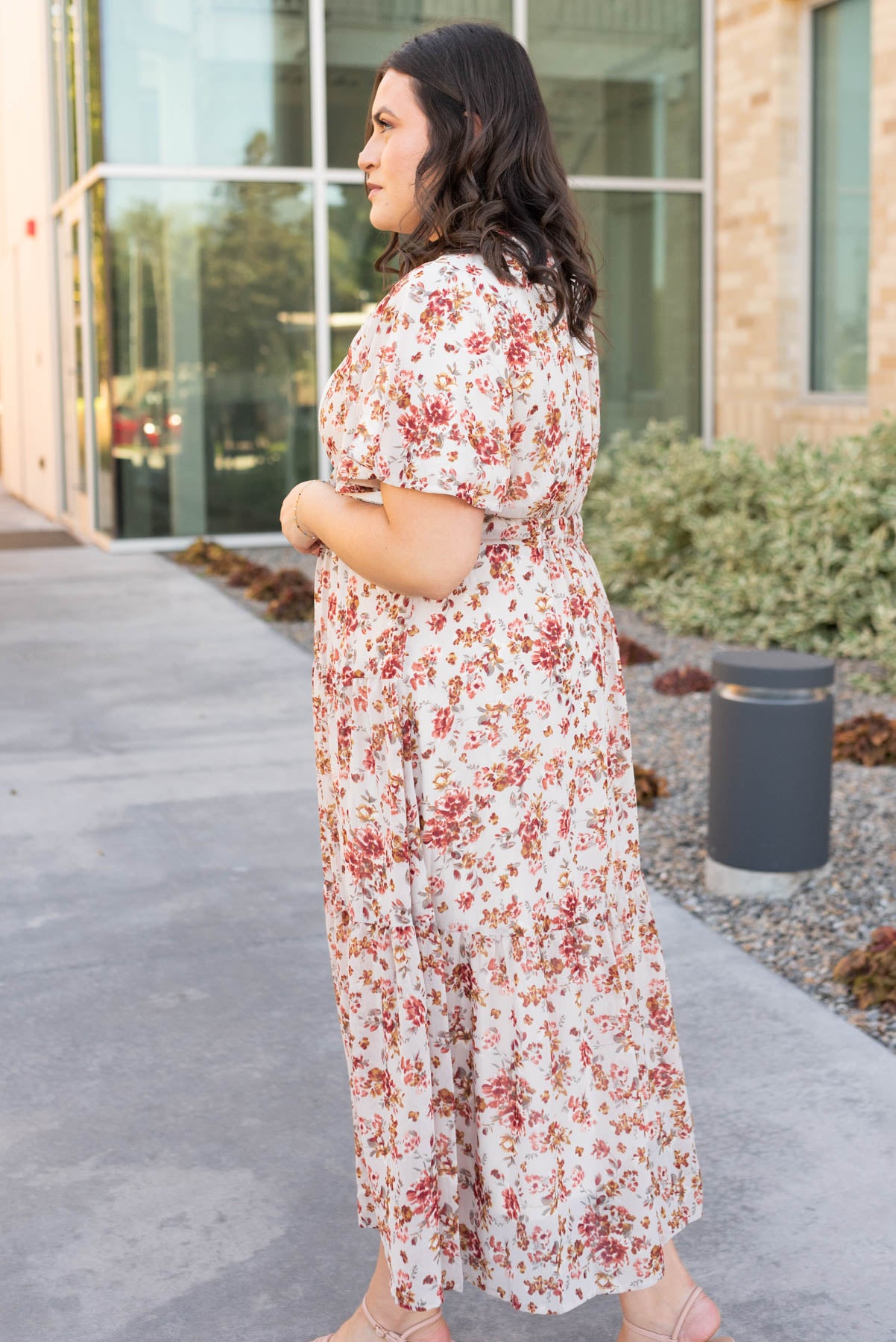 Side view of the cream floral tiered dress in plus size