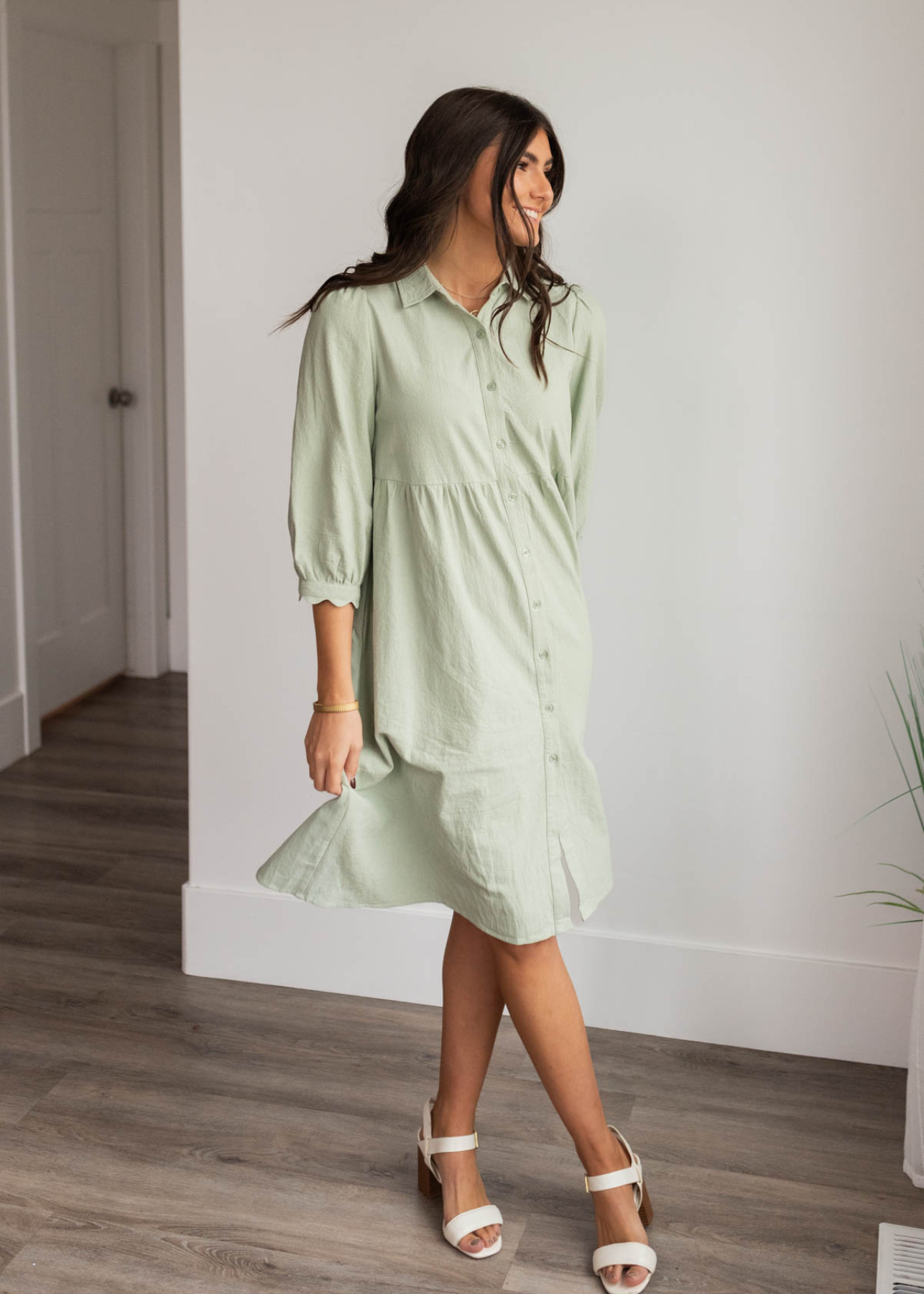 Green button down dress with long sleeves