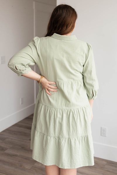 Back view of the green buttondown dress in plus size