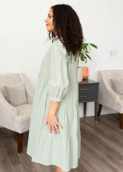 Side view of the sage button down dress