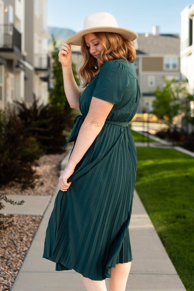 Side view of a hunter green dress