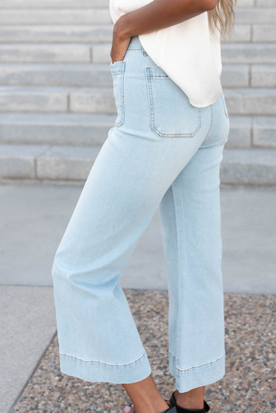 Side view of the light denim wide leg pants