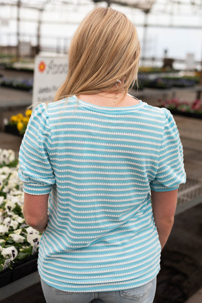 Back view of the blue top with white stripes