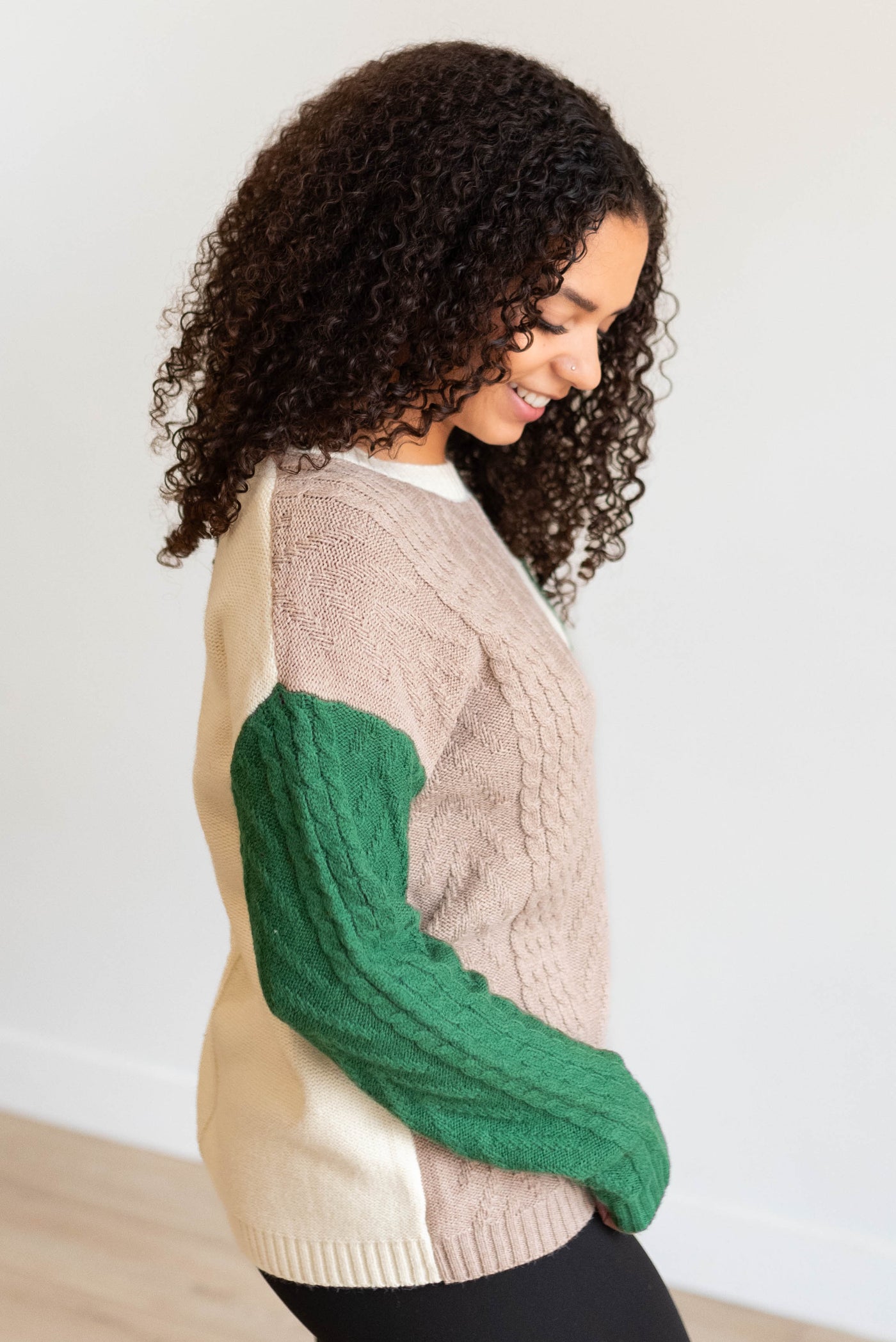 Side view of the green color block sweater